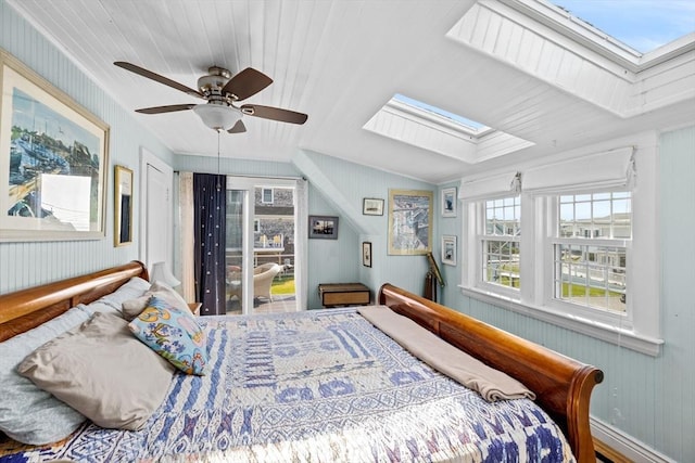 bedroom featuring ceiling fan and lofted ceiling with skylight