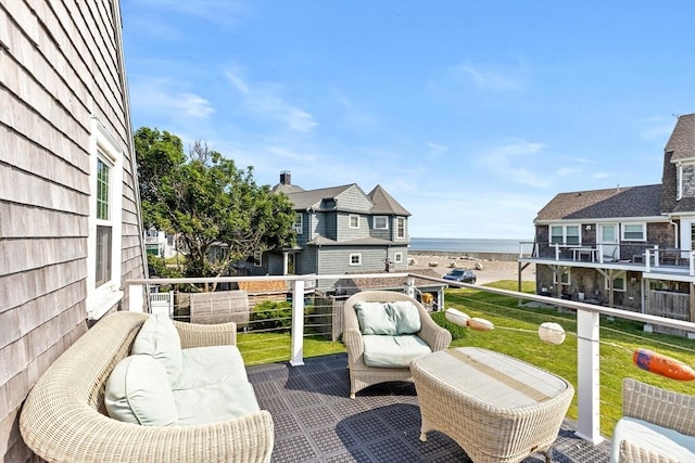 view of patio / terrace with a water view and a balcony