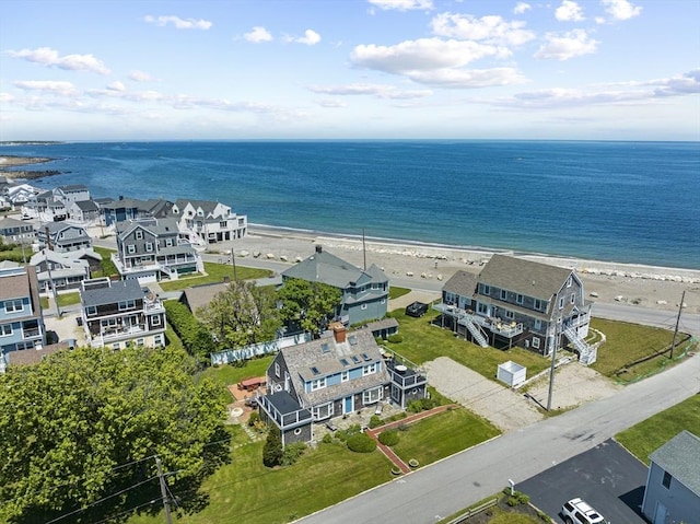 aerial view featuring a water view and a beach view