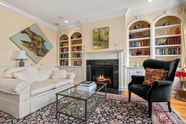 151 Beacon St Unit 4, Boston, MA 02116 - living room with built in features, crown molding, a fireplace, wood finished floors, and recessed lighting