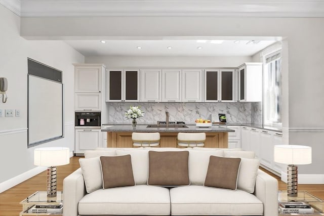 151 Beacon St Unit 4, Boston, MA 02116 - kitchen with a sink, light wood-style floors, glass insert cabinets, backsplash, and recessed lighting
