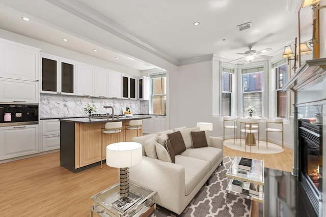 151 Beacon St Unit 4, Boston, MA 02116 - living area with light wood-style flooring, crown molding, a ceiling fan, recessed lighting, and baseboards