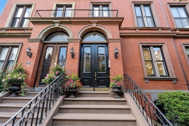 151 Beacon St Unit 4, Boston, MA 02116 - view of exterior entry featuring french doors and brick siding