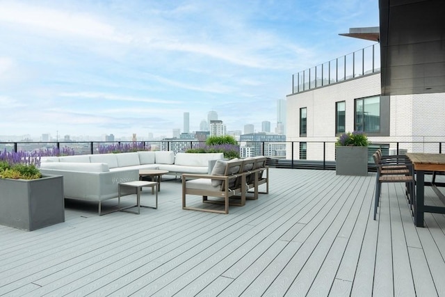 14 W Broadway Unit 703, Boston, MA 02127 - wooden deck featuring an outdoor living space and a view of skyline