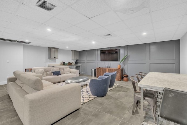 14 W Broadway Unit 703, Boston, MA 02127 - living room with a decorative wall, bar, a paneled ceiling, and recessed lighting
