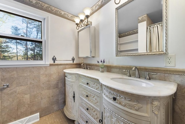 bathroom with vanity, tile patterned floors, and tile walls