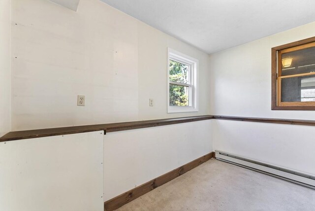 spare room featuring a baseboard heating unit