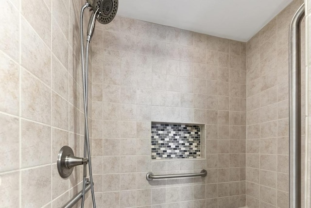 bathroom with a tile shower