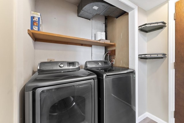 laundry room with separate washer and dryer