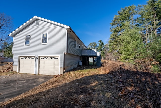 view of property exterior featuring a garage