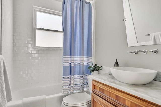 full bath with vanity, toilet, and shower / tub combo with curtain