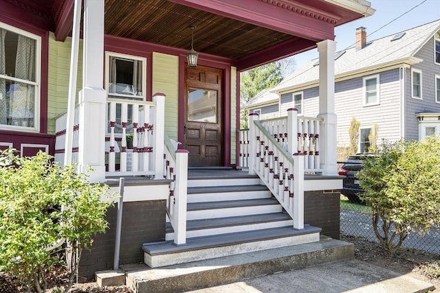 wooden terrace featuring covered porch