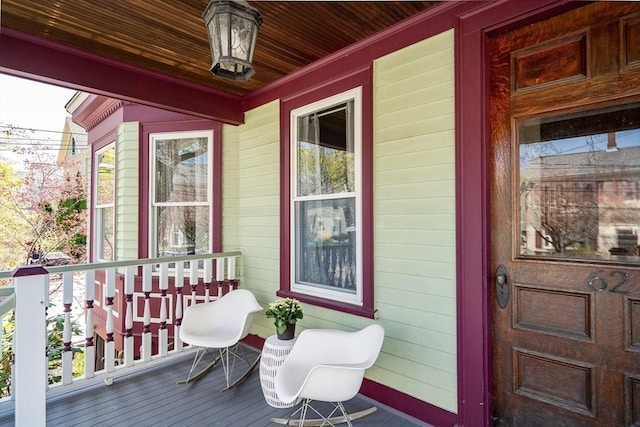 wooden terrace featuring a porch