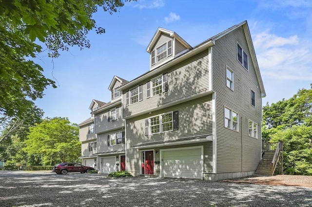 459 Brook St Unit C, Clinton, MA 01510 - view of front facade featuring stairs, an attached garage, and driveway