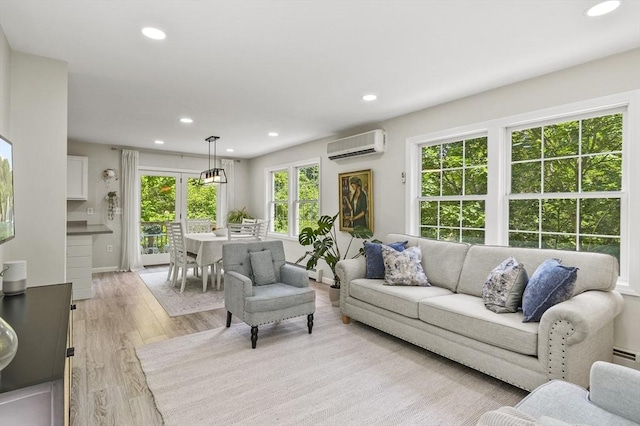 459 Brook St Unit C, Clinton, MA 01510 - living area featuring an AC wall unit, recessed lighting, and light wood-style flooring