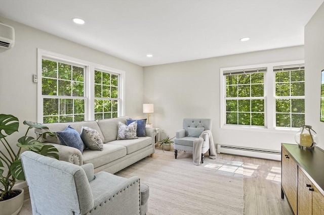 459 Brook St Unit C, Clinton, MA 01510 - living room with baseboard heating, light wood finished floors, recessed lighting, and a wall mounted AC