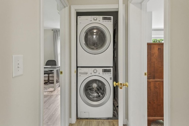 459 Brook St Unit C, Clinton, MA 01510 - laundry room with stacked washing machine and dryer and wood finished floors