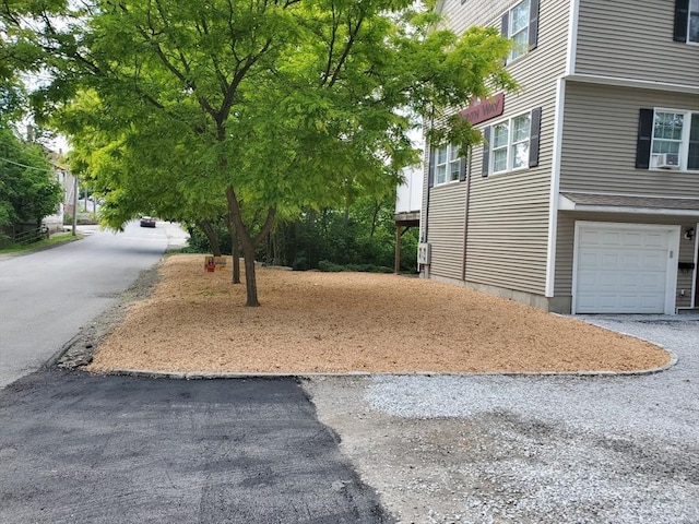 459 Brook St Unit C, Clinton, MA 01510 - view of side of property featuring an attached garage and asphalt driveway
