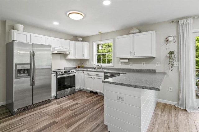 459 Brook St Unit C, Clinton, MA 01510 - kitchen featuring stainless steel appliances, under cabinet range hood, a peninsula, white cabinetry, and recessed lighting