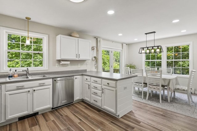 459 Brook St Unit C, Clinton, MA 01510 - kitchen with stainless steel dishwasher, white cabinetry, a peninsula, recessed lighting, and dark wood-type flooring