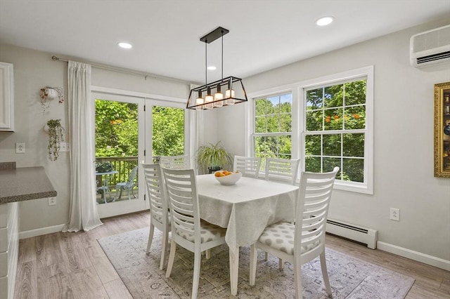 459 Brook St Unit C, Clinton, MA 01510 - dining area with a baseboard radiator, a wall unit AC, recessed lighting, and light wood-type flooring
