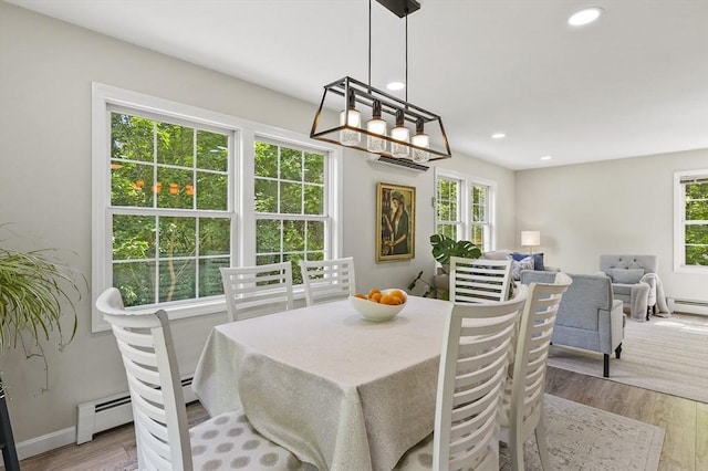 459 Brook St Unit C, Clinton, MA 01510 - dining area featuring healthy amount of natural light, wood finished floors, a baseboard radiator, and recessed lighting