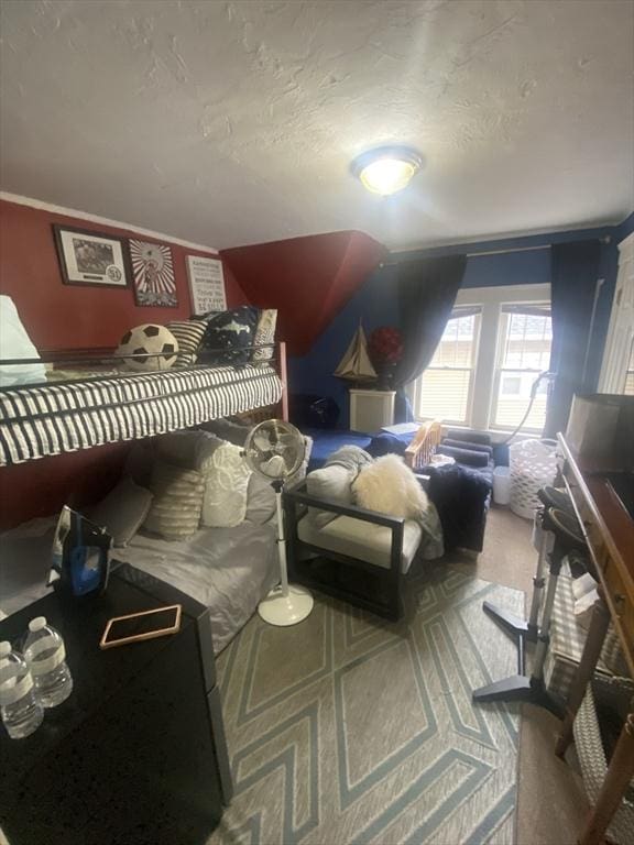 bedroom with ornamental molding and a textured ceiling