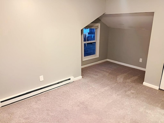 bonus room with baseboard heating and carpet