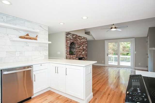 kitchen with dishwasher, lofted ceiling, white cabinets, light hardwood / wood-style flooring, and kitchen peninsula