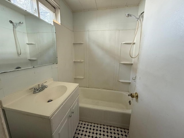 full bath featuring vanity and  shower combination