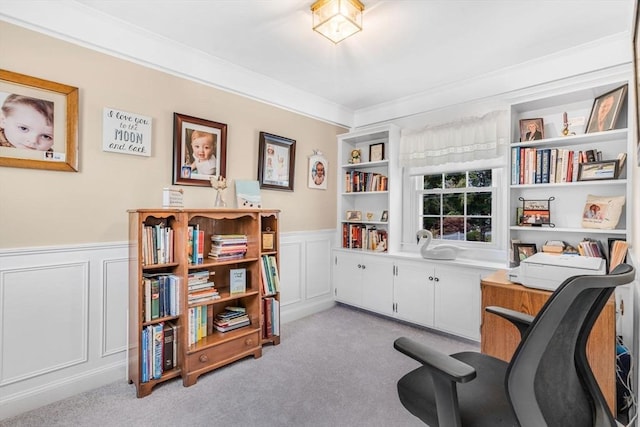 living area featuring crown molding and light colored carpet