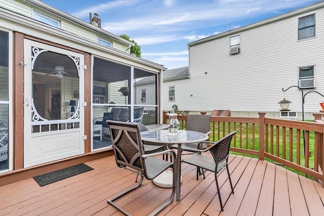 wooden deck featuring a sunroom