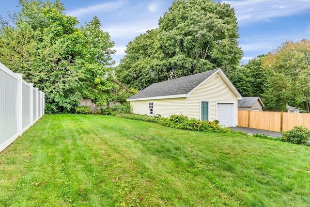 view of yard with an outbuilding and a garage