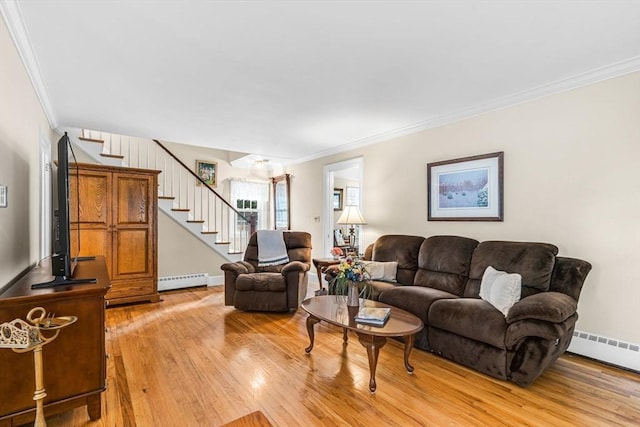 living room featuring crown molding, a baseboard radiator, and light hardwood / wood-style floors