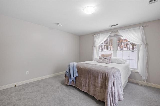 bedroom featuring carpet flooring, visible vents, and baseboards