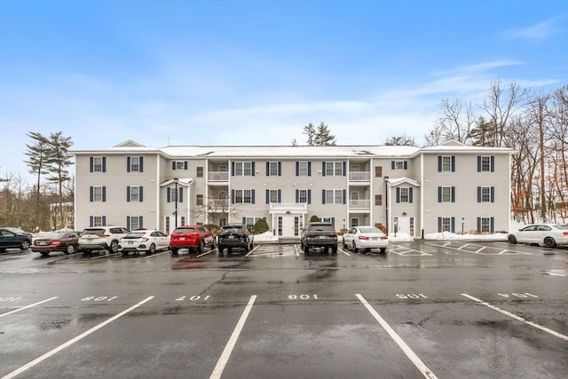 view of property with uncovered parking