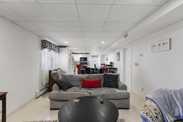 16 Windsor St, Everett, MA 02149 - living room featuring baseboard heating, a drop ceiling, light colored carpet, baseboards, and recessed lighting