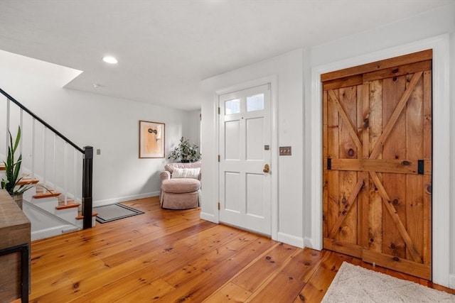 foyer entrance with light wood-type flooring