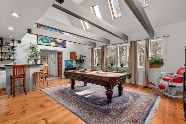 recreation room with bar area, beamed ceiling, light wood-type flooring, and pool table