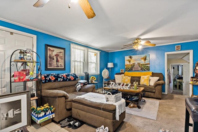 living room featuring crown molding and a ceiling fan