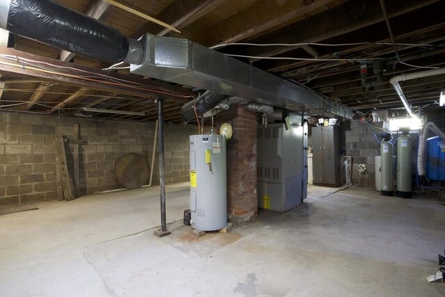 unfinished below grade area with heating unit and water heater