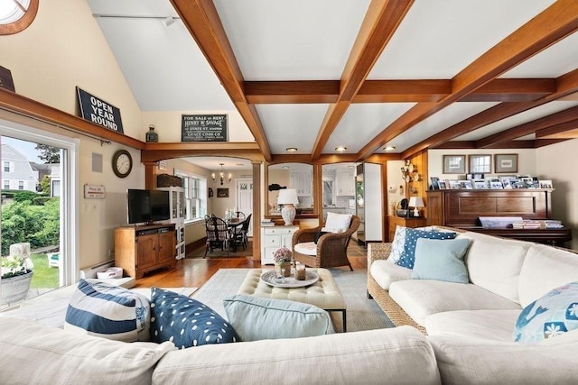 107 Channel Point Rd, Barnstable, MA 02601 - living area featuring ornate columns, beam ceiling, light wood-type flooring, a chandelier, and arched walkways