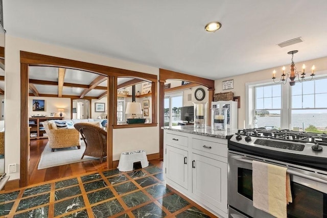 107 Channel Point Rd, Barnstable, MA 02601 - kitchen featuring stainless steel gas stove, a chandelier, plenty of natural light, white cabinetry, and beamed ceiling