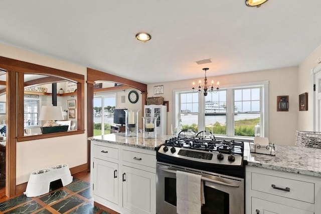 107 Channel Point Rd, Barnstable, MA 02601 - kitchen featuring gas range, a chandelier, plenty of natural light, and white cabinets