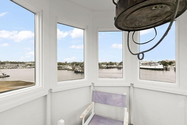 107 Channel Point Rd, Barnstable, MA 02601 - sunroom featuring a water view and plenty of natural light