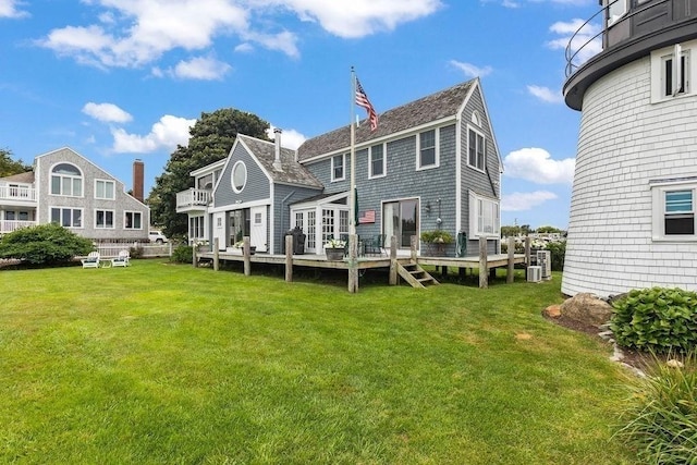107 Channel Point Rd, Barnstable, MA 02601 - back of property with a wooden deck and a lawn