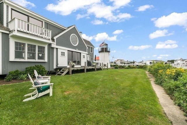107 Channel Point Rd, Barnstable, MA 02601 - rear view of property featuring a lawn, a balcony, and a wooden deck
