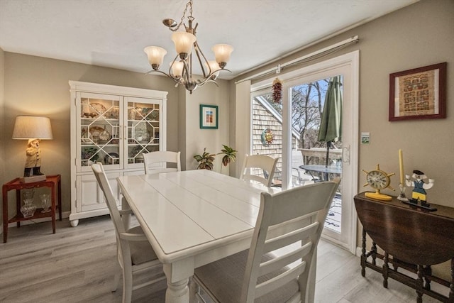 2 Englewood Dr Unit Jl, Harwich, MA 02645 - dining area with a chandelier and light wood-style floors