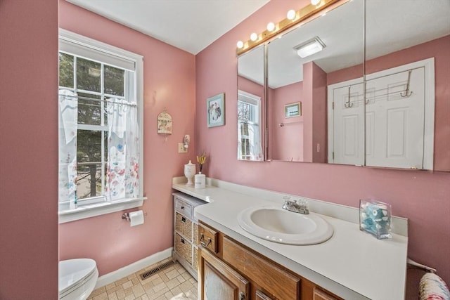 2 Englewood Dr Unit Jl, Harwich, MA 02645 - bathroom with baseboards, vanity, and toilet