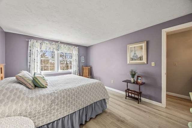 2 Englewood Dr Unit Jl, Harwich, MA 02645 - bedroom with light wood finished floors, baseboards, and a textured ceiling